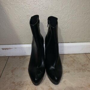 Black leather heeled boots with pointed toe and 3” heel